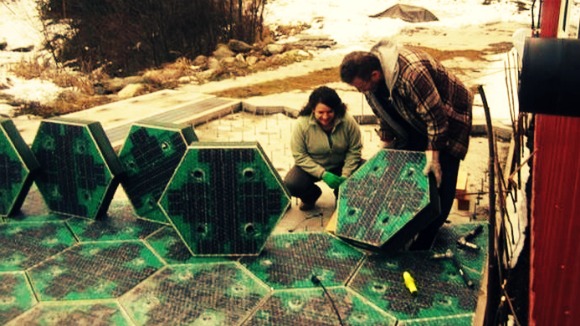 Scott and Julie Brusaw installing the solar roadway panels on their garage floor on a snowy afternoon
